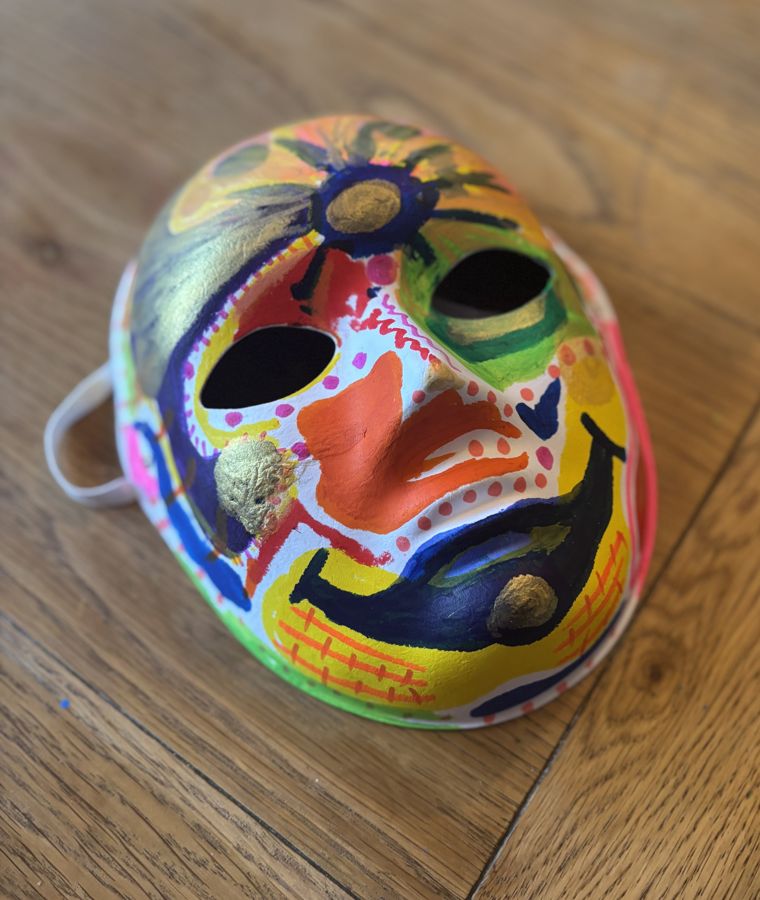 A colourful hand-painted mask