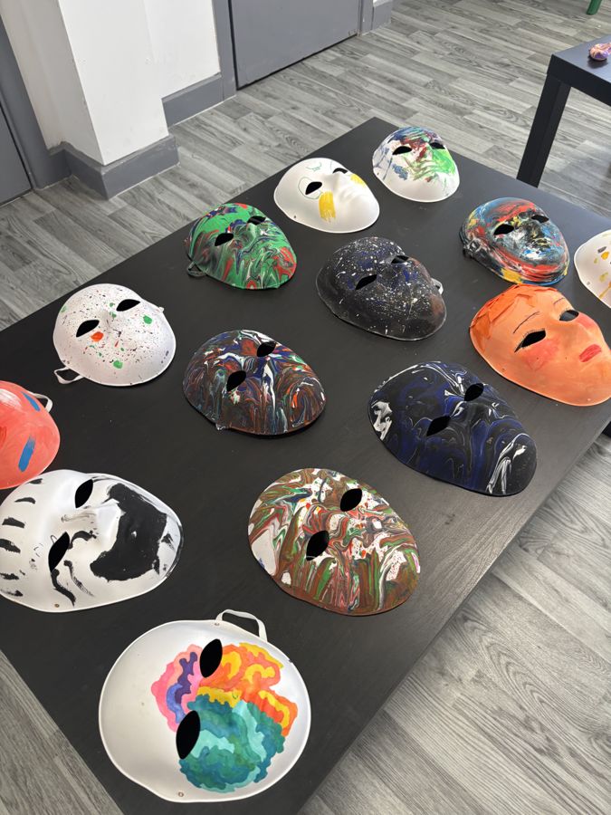 Painted masks from a group art therapy session